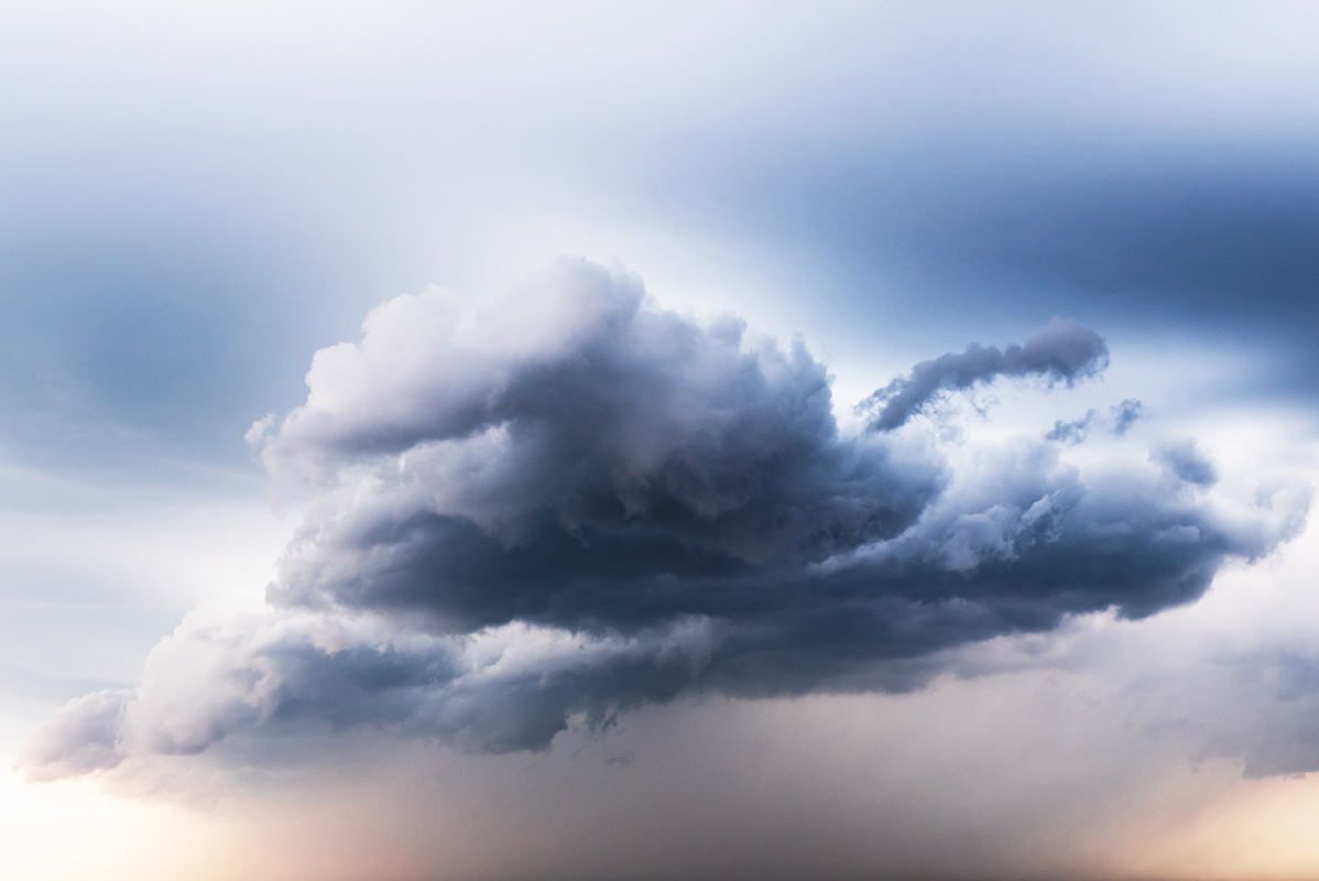 Open landscape with soft clouds and evening light